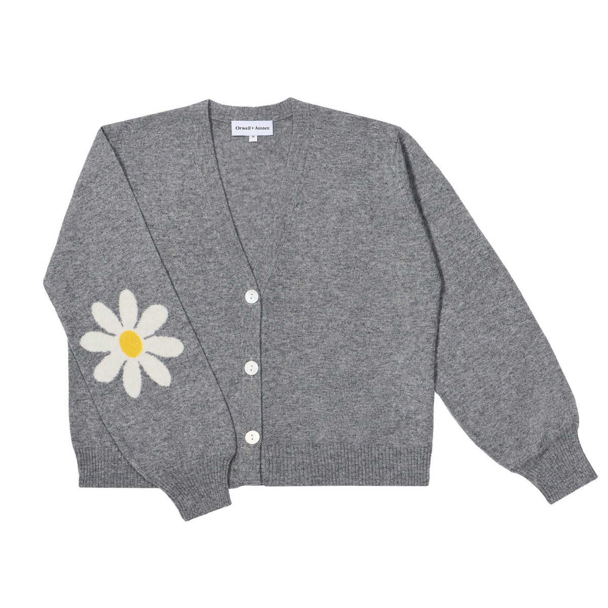 A grey knit cardigan sweater featuring a large white daisy with a yellow center embroidered on the left sleeve, displayed flat against a solid white background.